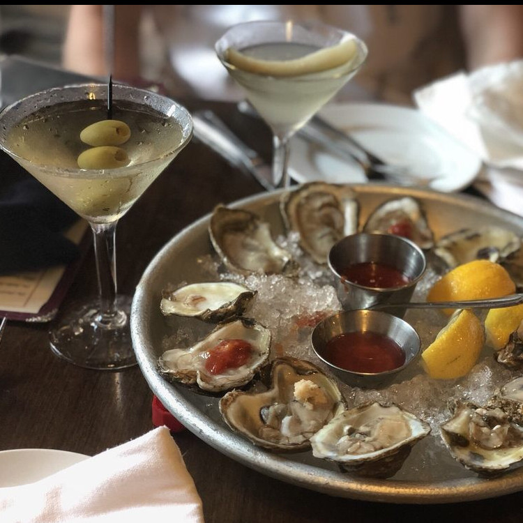 Two dozen East coast blue point oysters and two martinis